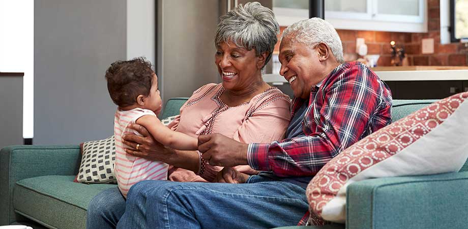 Seniors enjoying time with their grandchild